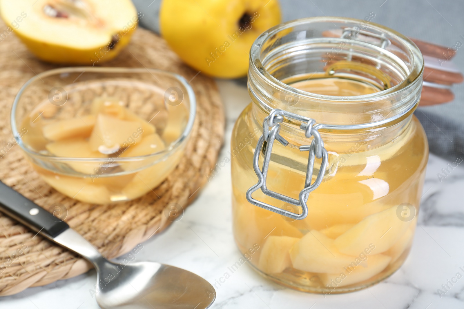 Photo of Delicious quince drink on white table, closeup