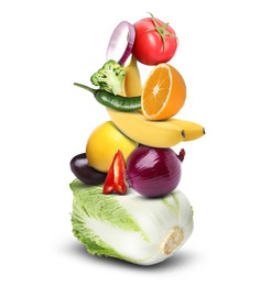 Stack of different vegetables and fruits isolated on white