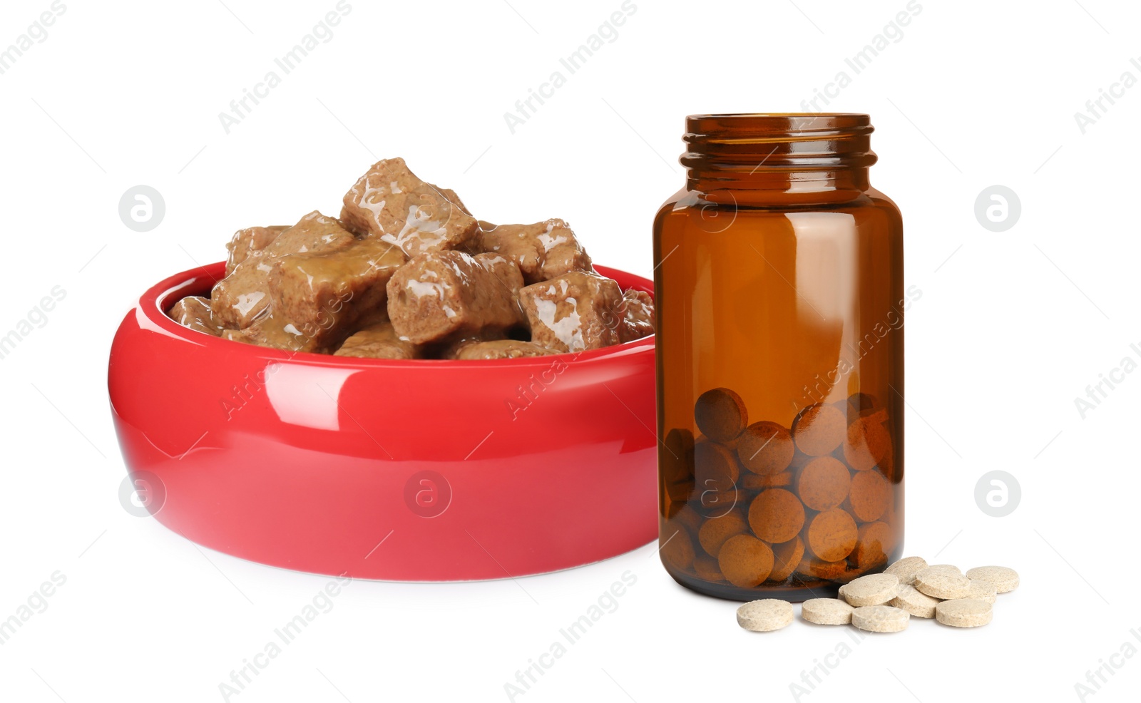 Image of Wet pet food in feeding bowl and bottle with vitamin pills on white background