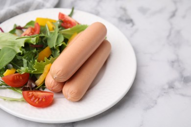 Photo of Delicious boiled sausages with salad on white marble table, closeup