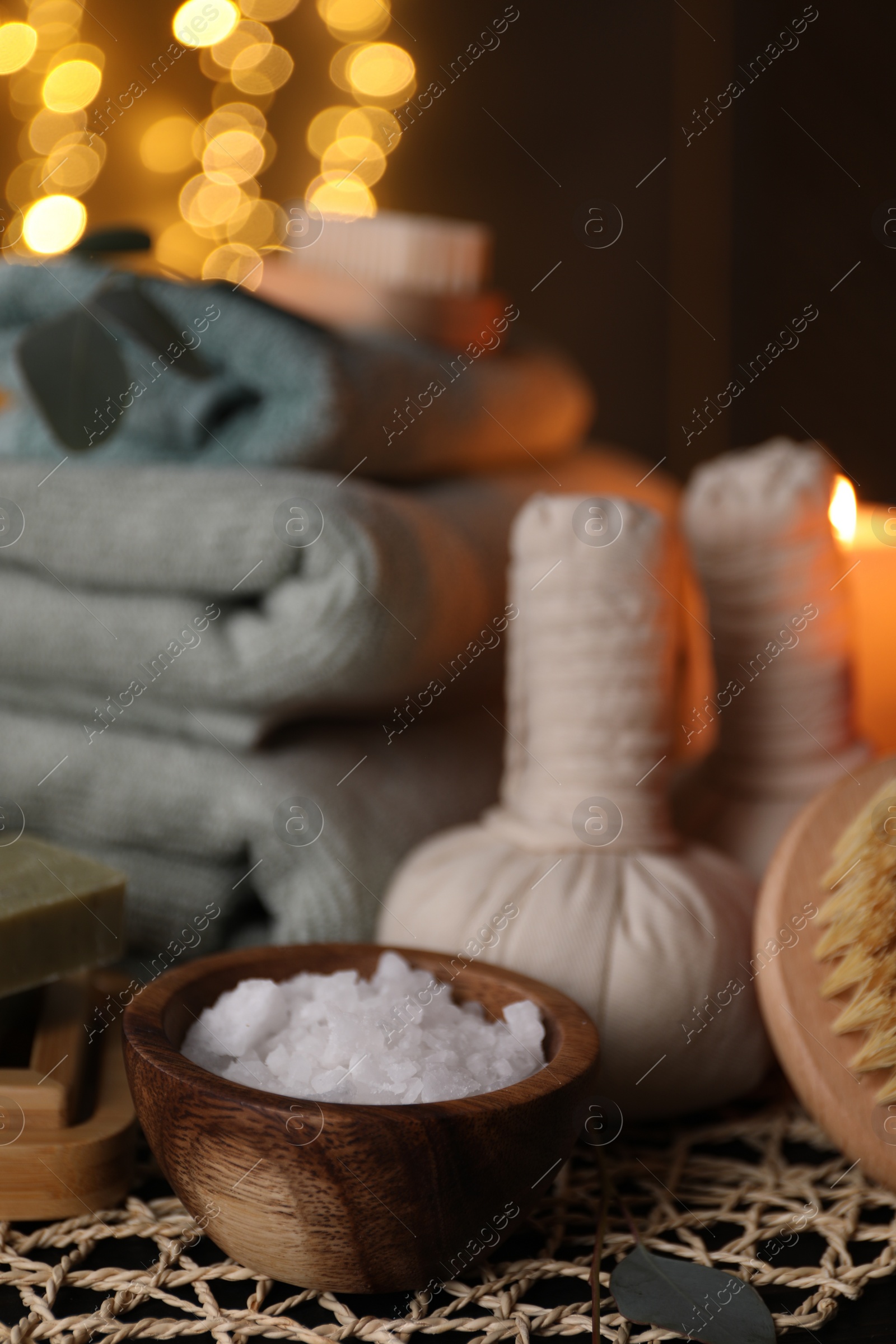 Photo of Beautiful composition with different spa products on table against blurred lights