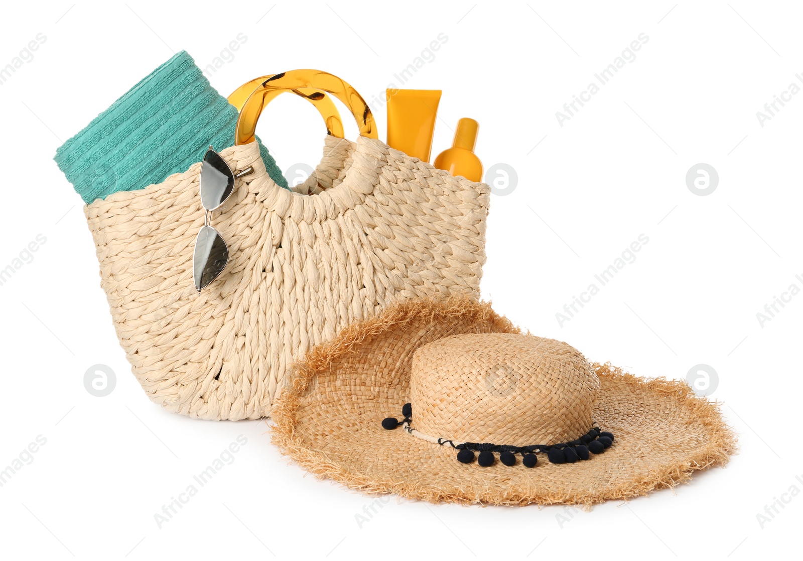 Photo of Stylish straw hat, beach bag and sunglasses on white background