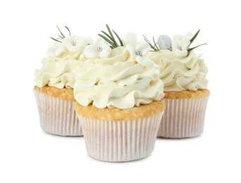 Photo of Tasty Easter cupcakes with vanilla cream isolated on white