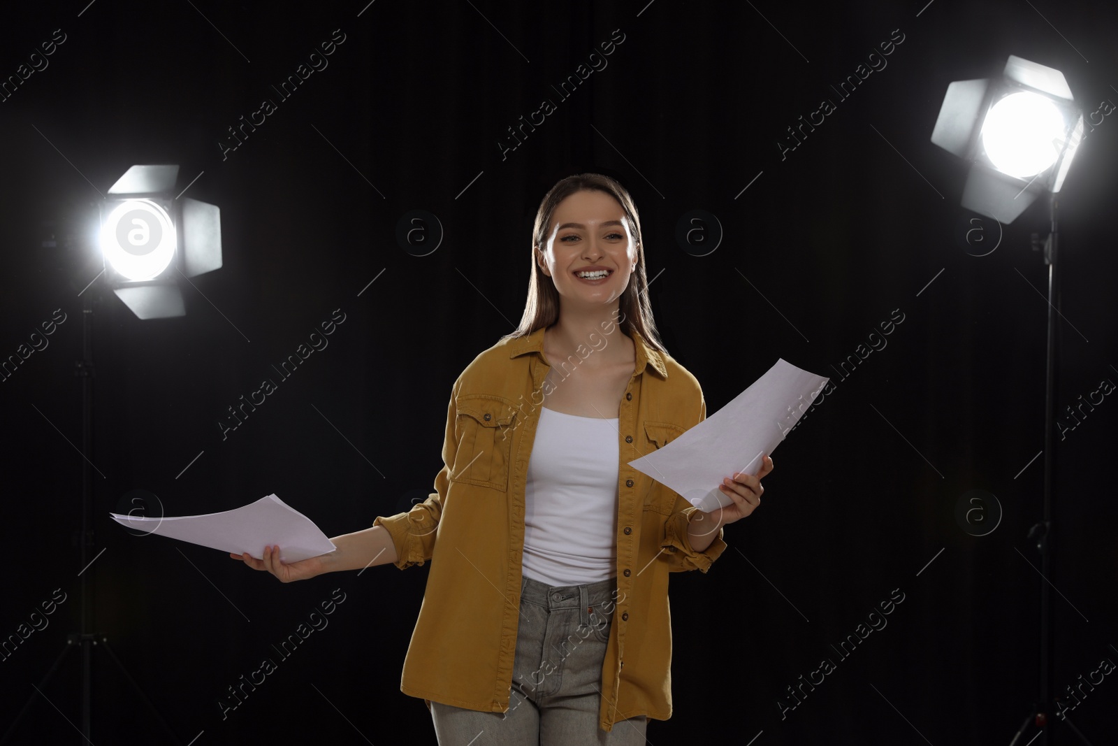 Photo of Professional actress reading her script during rehearsal in theatre