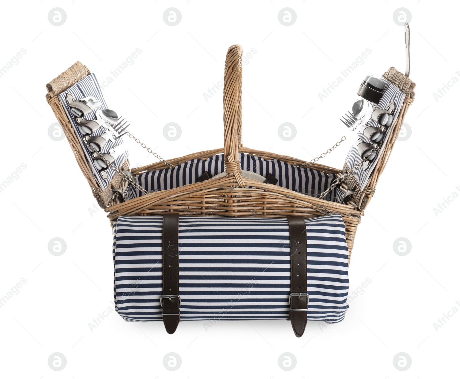 Photo of Wicker basket with picnic essentials and blanket on white background