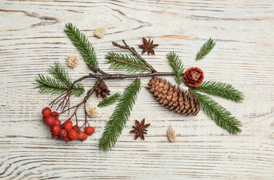 Flat lay composition with pinecones on white wooden background