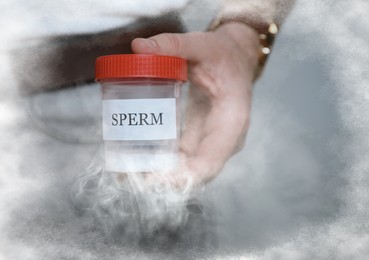 Cryopreservation. Donor holding container with sperm, closeup and space for text. Frost effect
