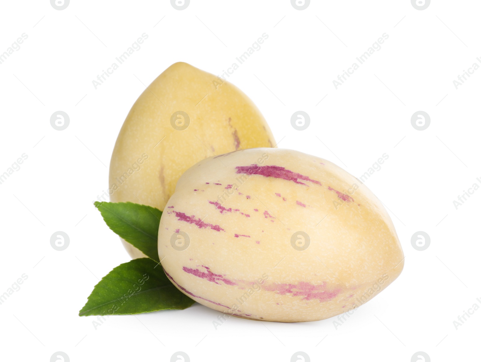 Photo of Fresh ripe pepino melons and green leaves on white background