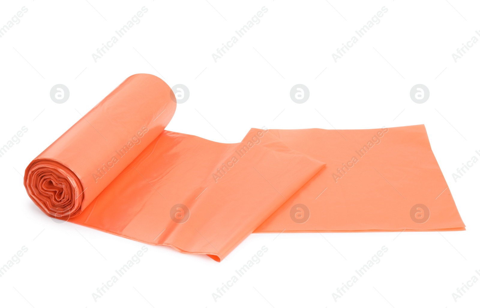 Photo of Roll of orange garbage bags isolated on white