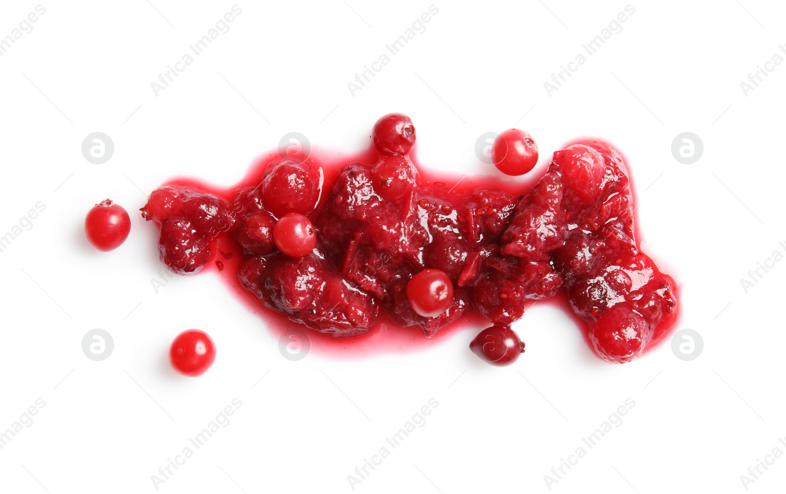 Photo of Spilled cranberry sauce on white background, top view