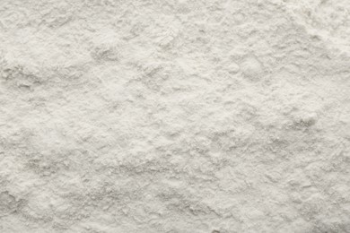 Photo of Texture of baking powder as background, top view