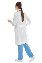 Photo of Doctor in clean uniform walking on white background