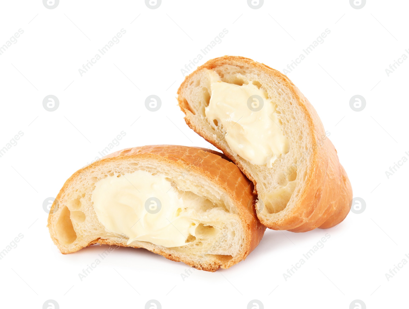 Photo of Halves of delicious croissant with cream on white background