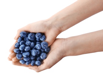 Woman holding fresh ripe blueberries on white background, closeup view