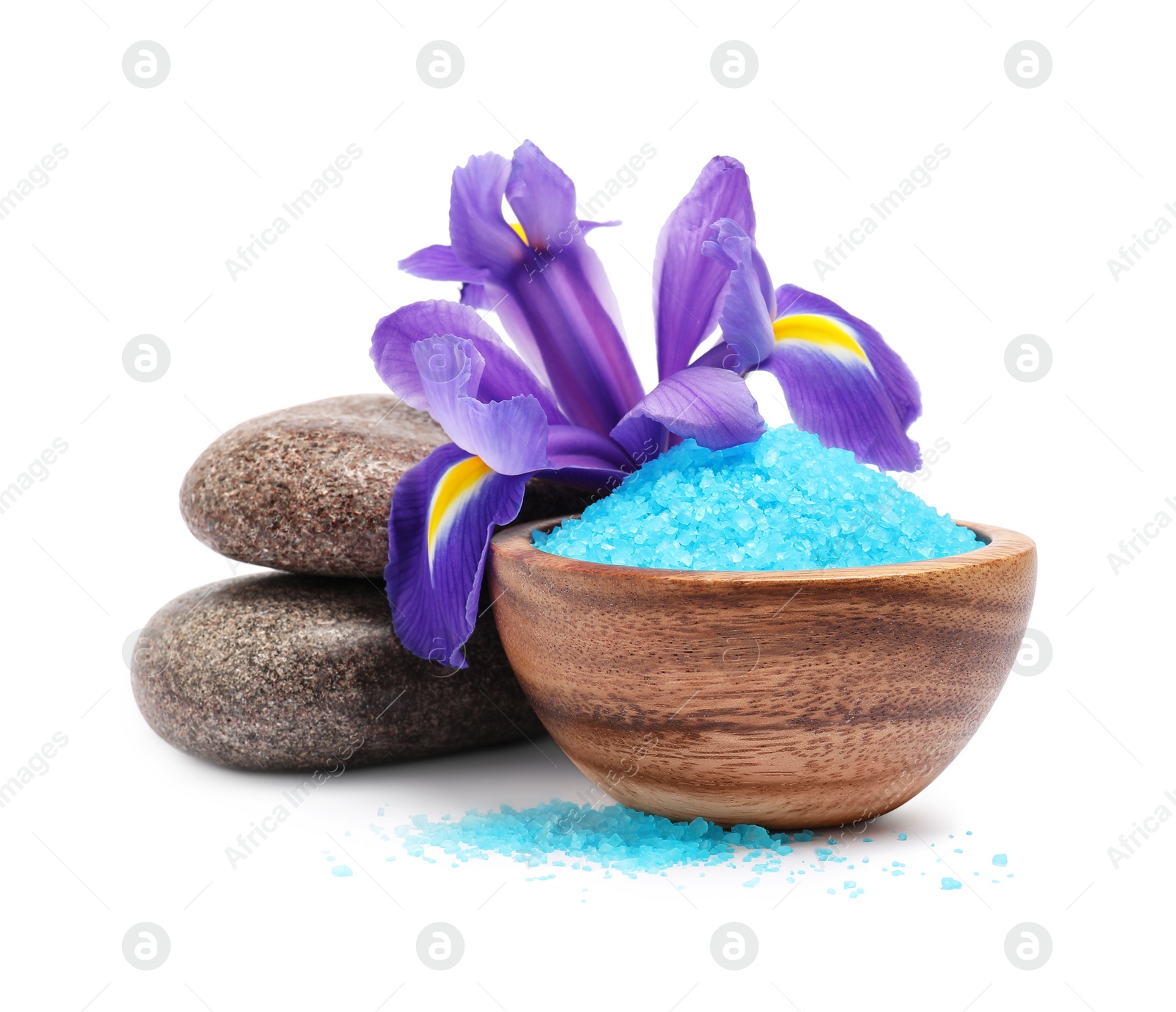 Photo of Light blue sea salt in bowl, spa stones and iris flower isolated on white