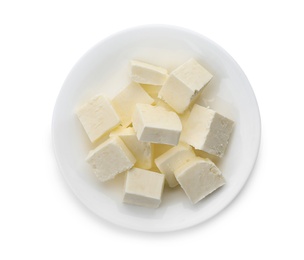 Plate with cubes of tasty fresh butter on white background, top view