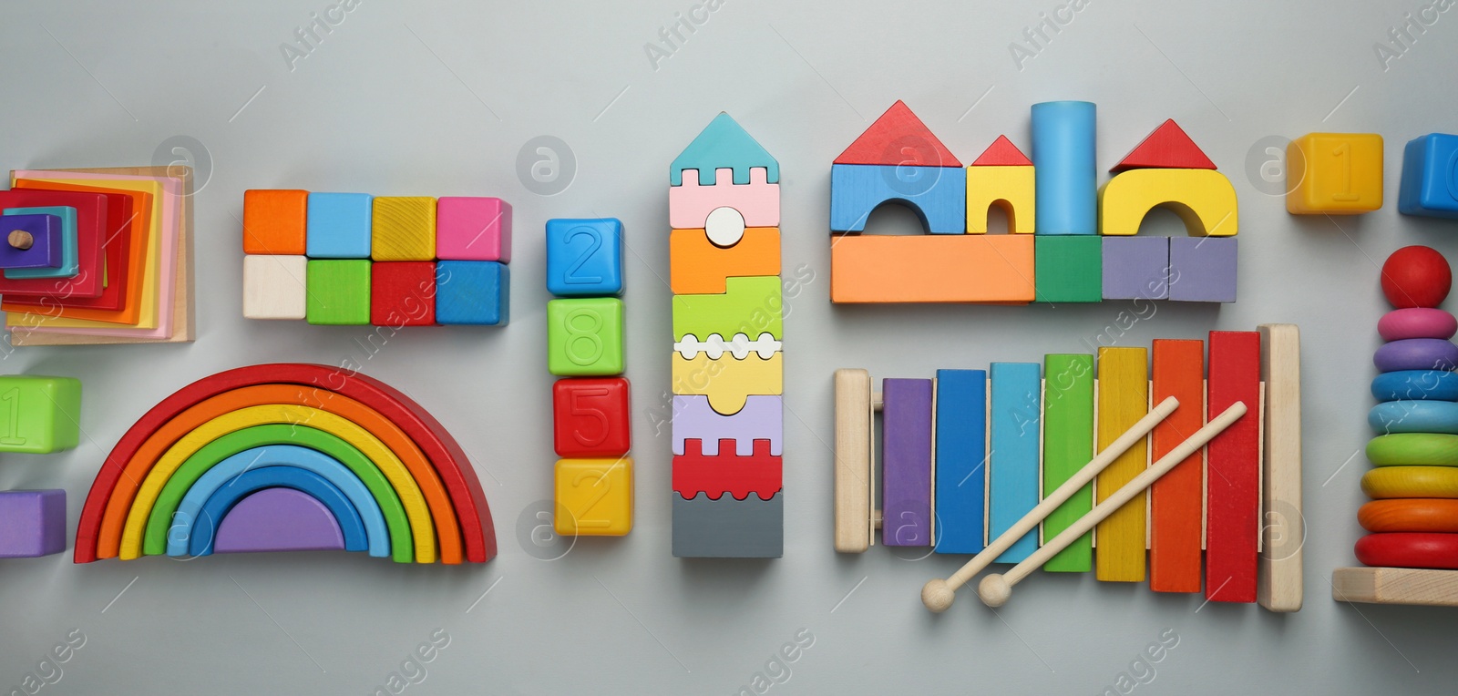 Photo of Different children's toys on light grey background, flat lay