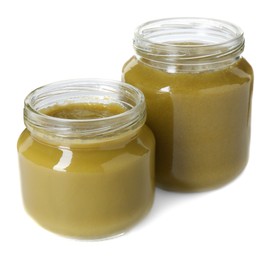 Photo of Baby food. Tasty healthy puree in jars isolated on white