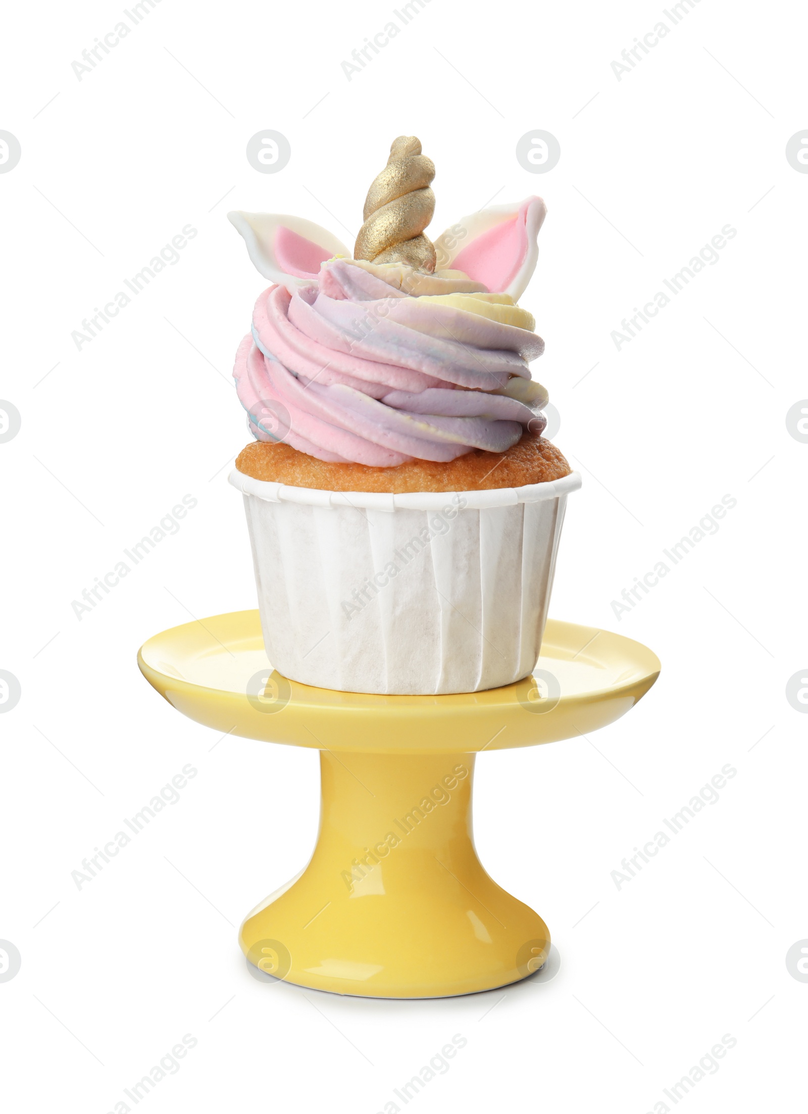 Photo of Yellow dessert stand with cute sweet unicorn cupcake isolated on white