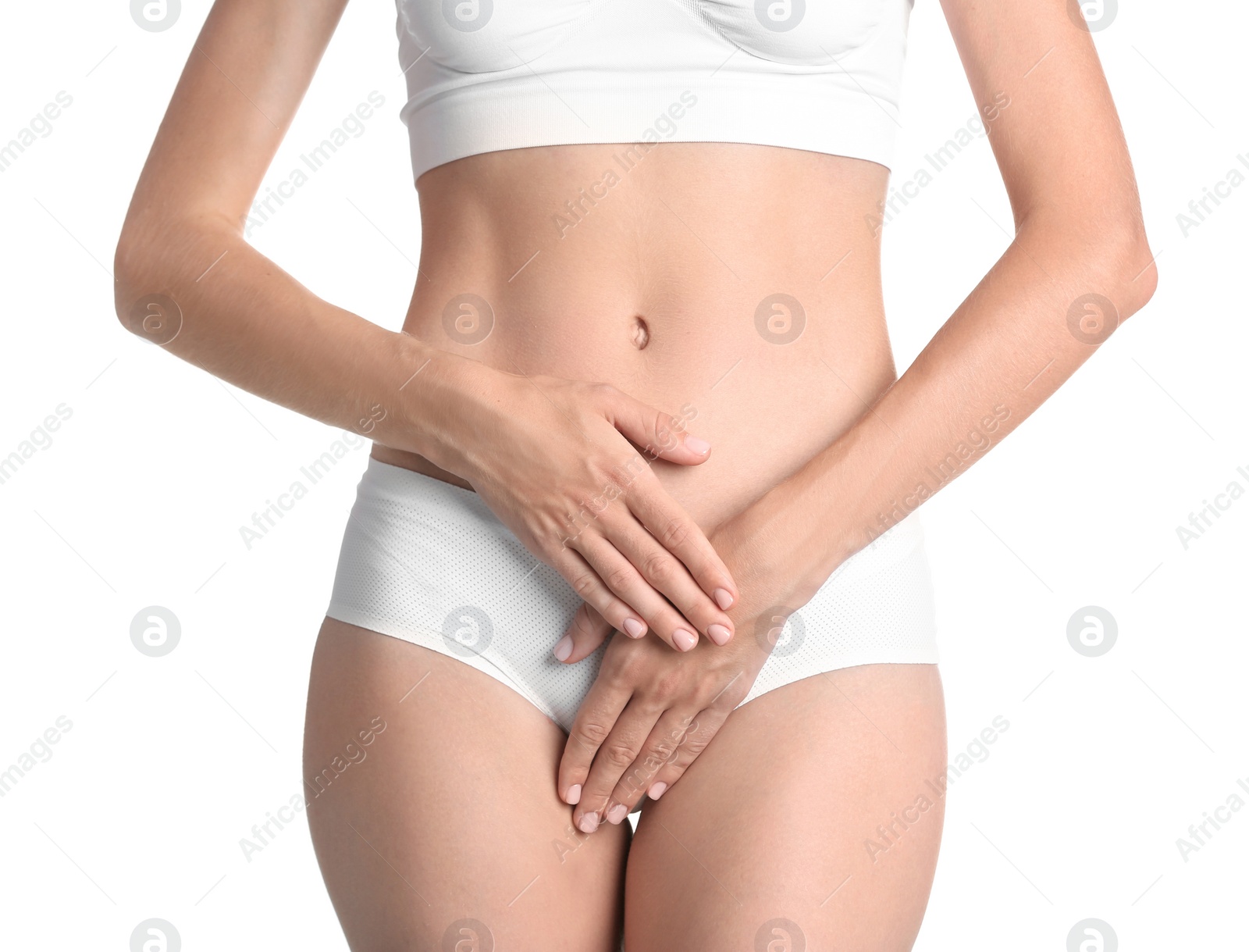 Photo of Young woman holding hands near panties on white background. Gynecology concept