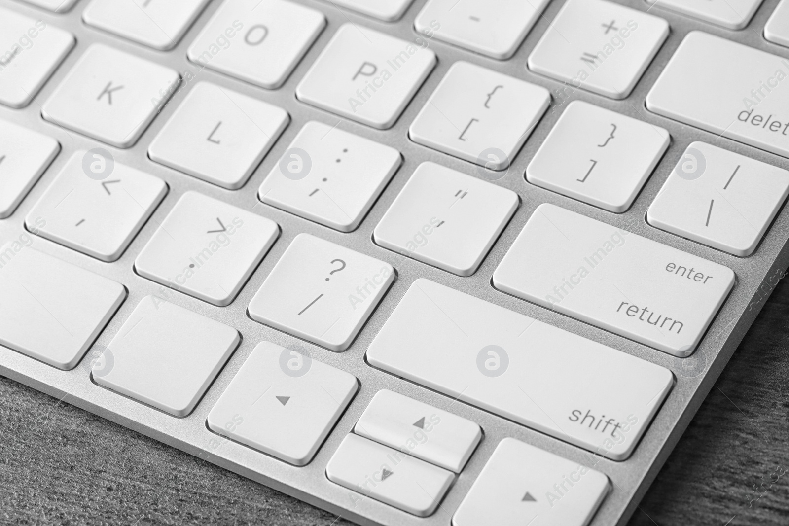 Photo of Modern computer keyboard on table, closeup view