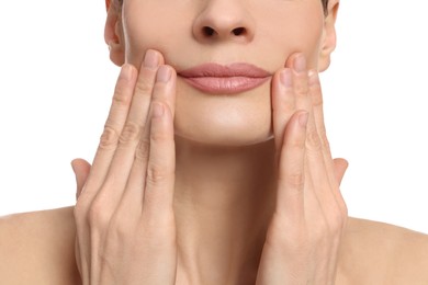 Photo of Woman massaging her face on white background, closeup