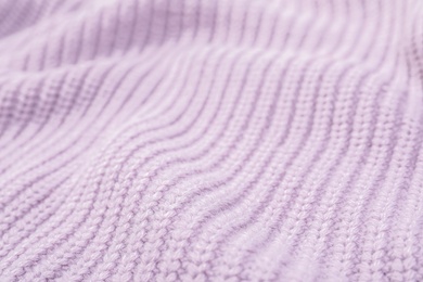 Photo of Texture of cozy warm sweater as background, closeup