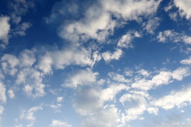 Picturesque view of beautiful fluffy clouds in light blue sky