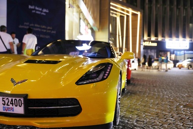 DUBAI, UNITED ARAB EMIRATES - NOVEMBER 03, 2018: Luxury car on city street at night