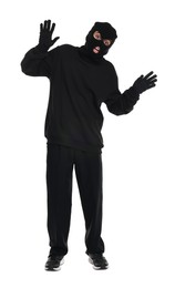 Photo of Emotional thief in balaclava raising hands on white background