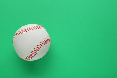 Photo of Baseball ball on green background, top view with space for text. Sports game