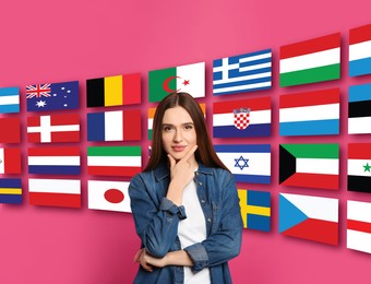Image of Portrait of interpreter and flags of different countries on pink background