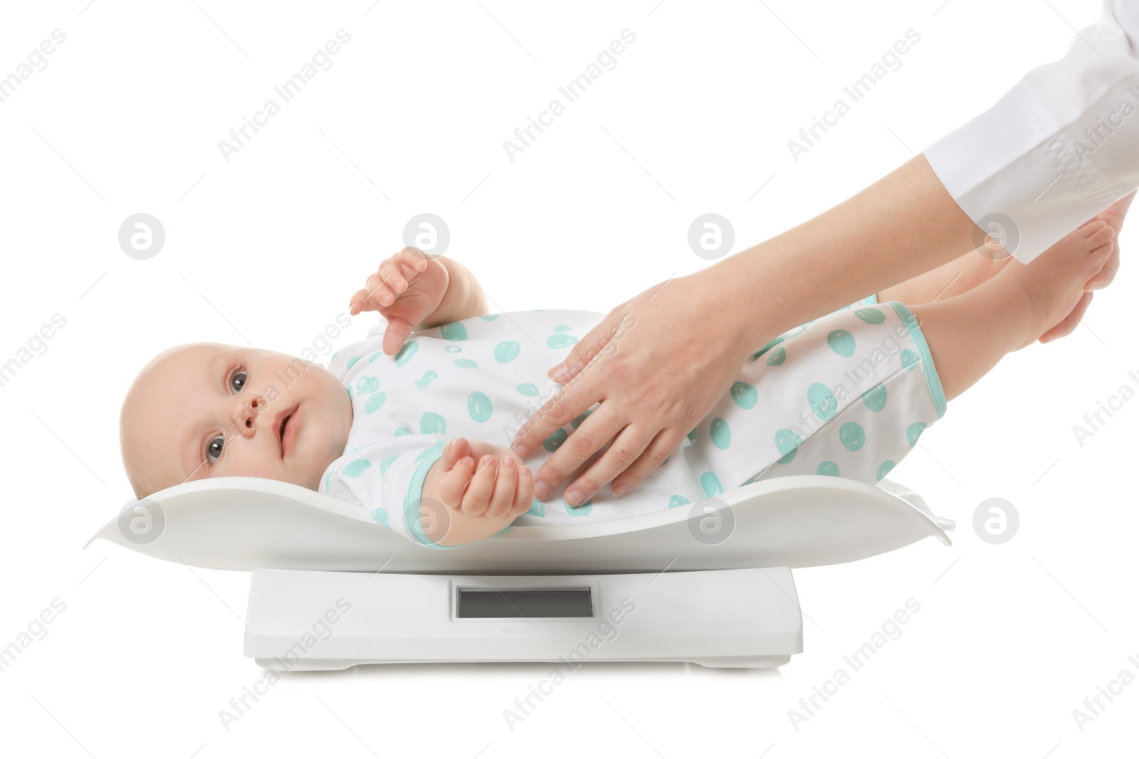 Photo of Doctor weighting baby on scales against white background