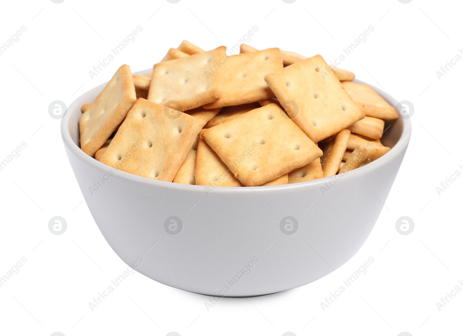 Photo of Tasty crackers in bowl isolated on white