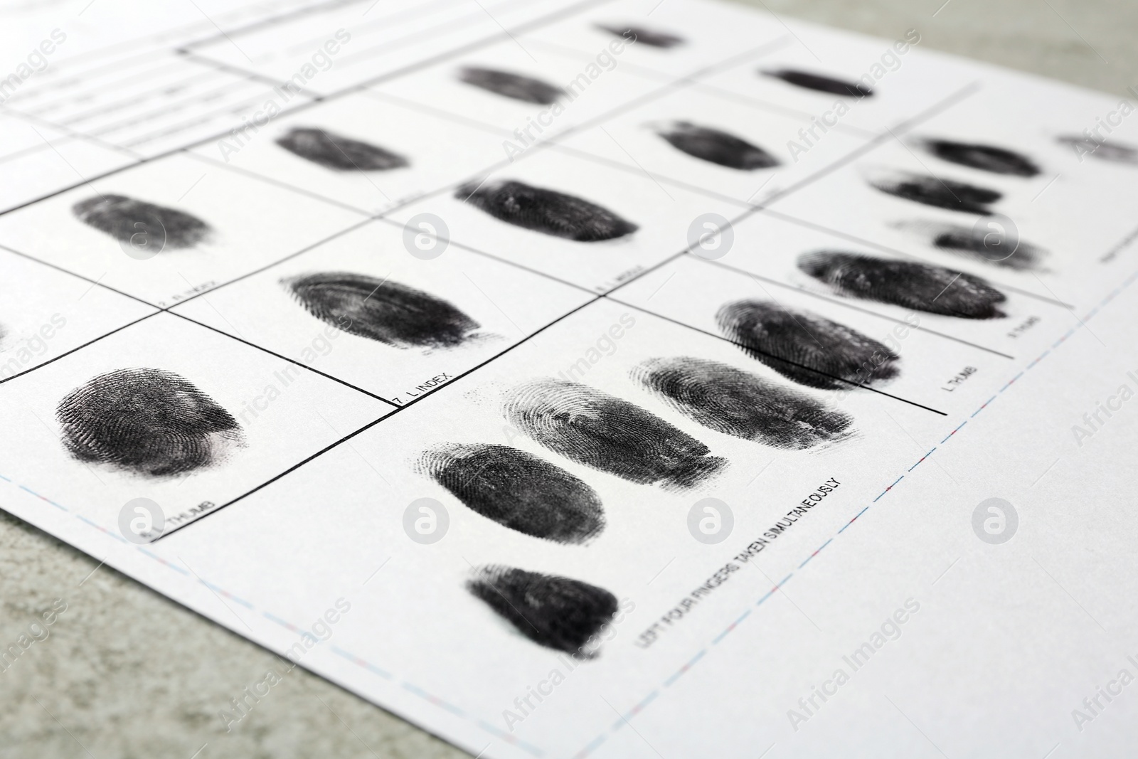 Photo of Police form with fingerprints, closeup. Forensic examination