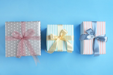 Different gift boxes on color background, flat lay