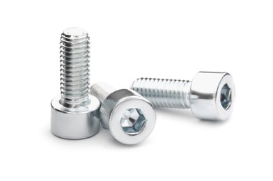 Photo of Three metal socket screws isolated on white