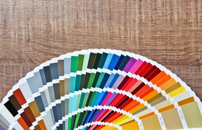 Photo of Color palette samples on wooden background