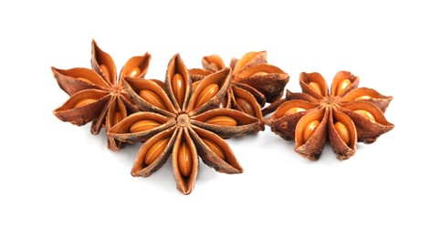 Photo of Dry anise stars with seeds on white background