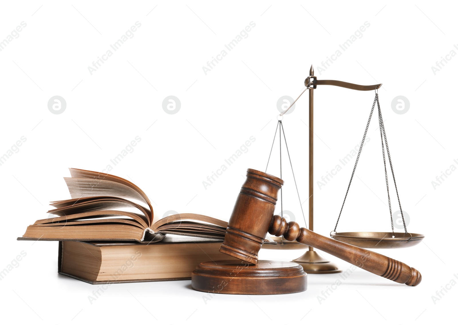 Photo of Wooden gavel, scales of justice and books on white background. Law concept