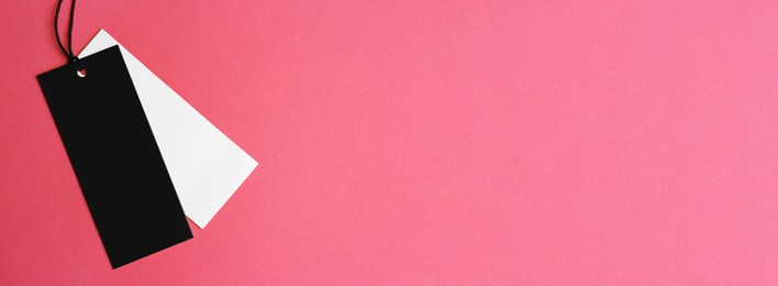 Image of Blank tags on pink background, top view with space for text. Banner design