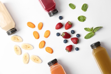 Photo of Flat lay composition with healthy detox smoothies and ingredients on light background