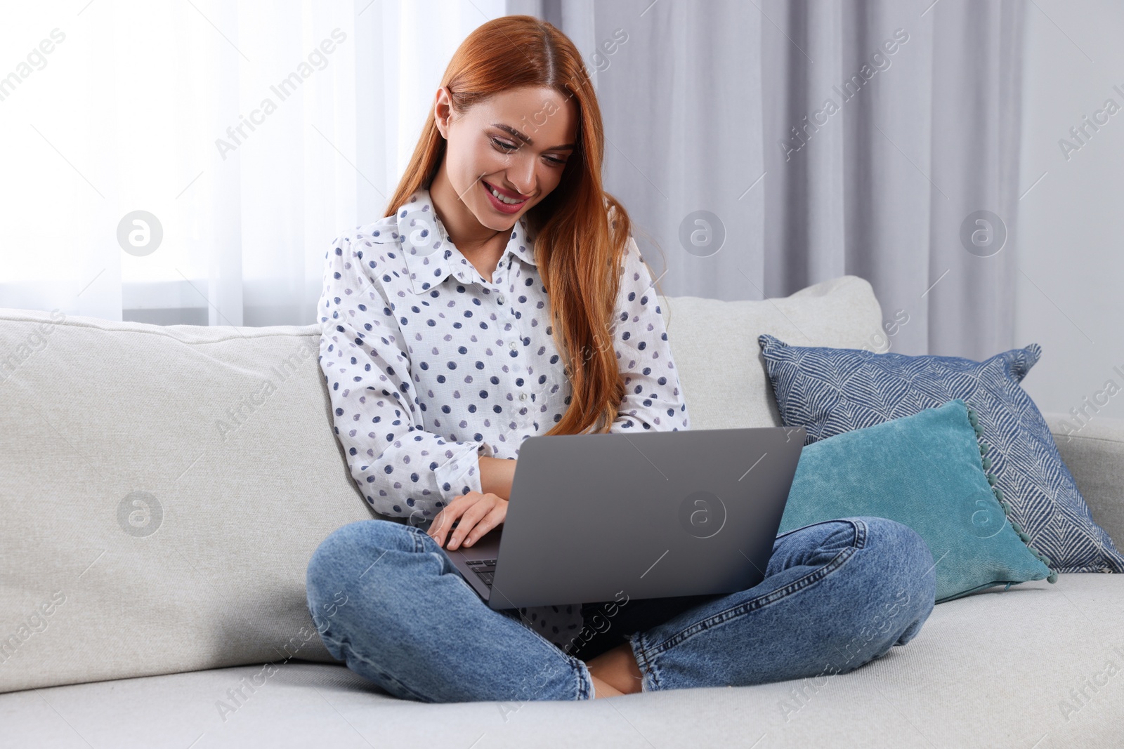 Photo of Woman having video chat via laptop at home