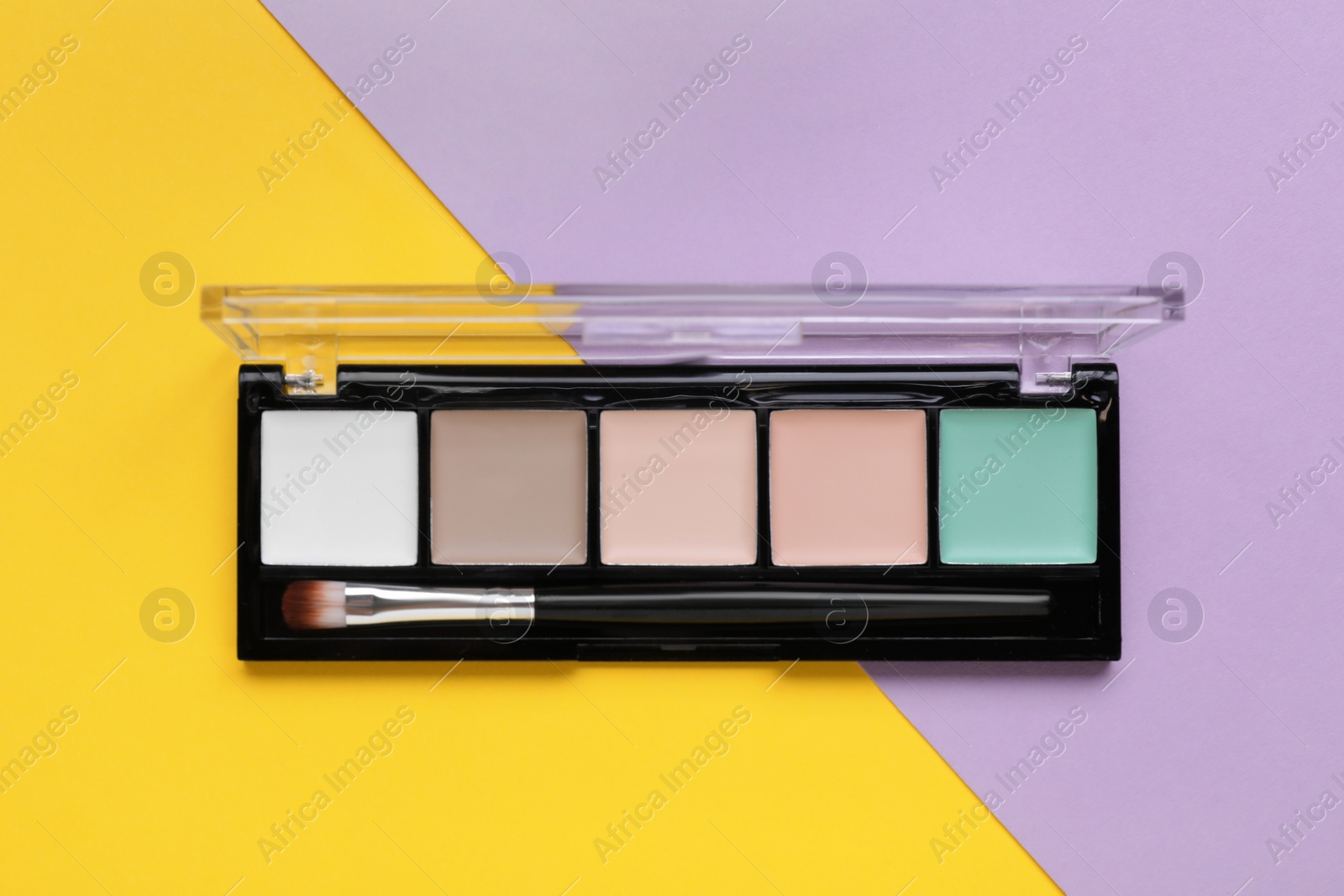 Photo of Contouring palette on color background, top view. Professional cosmetic product