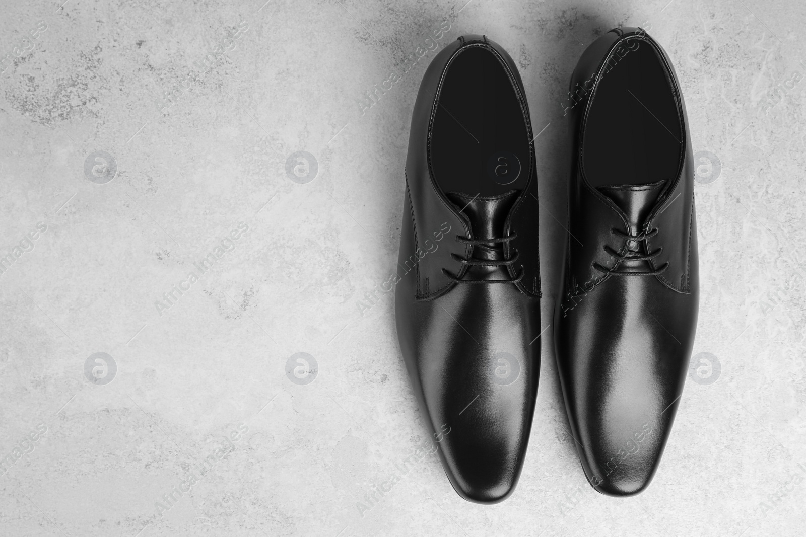 Photo of Elegant male shoes on light background