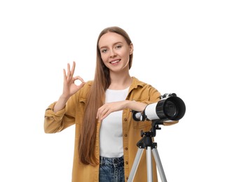 Happy astronomer with telescope showing OK gesture on white background