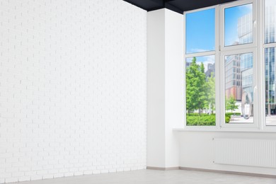 Empty office room with brick white wall and clean window. Interior design