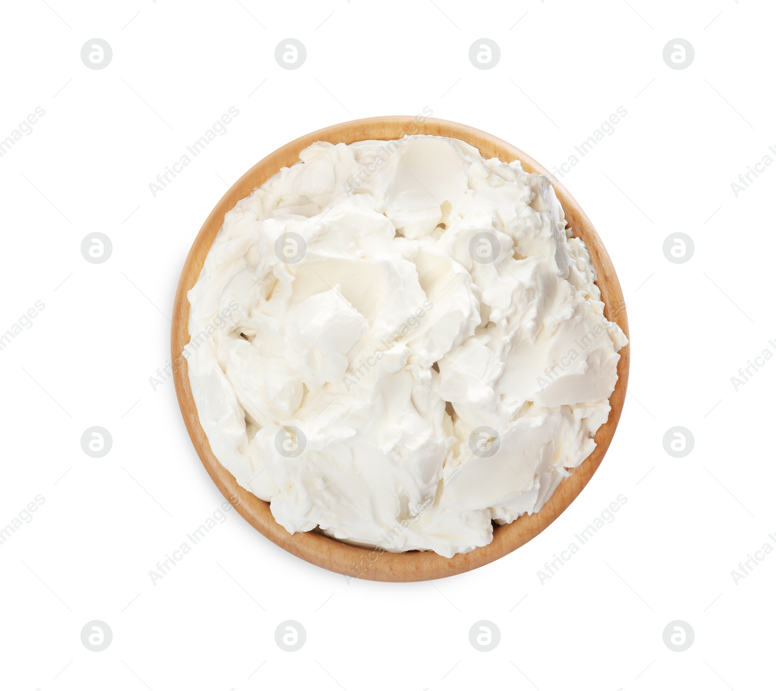 Photo of Wooden bowl of tasty cream cheese isolated on white, top view