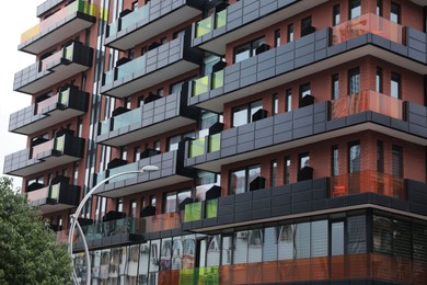 Photo of Exterior of residential building with balconies outdoors