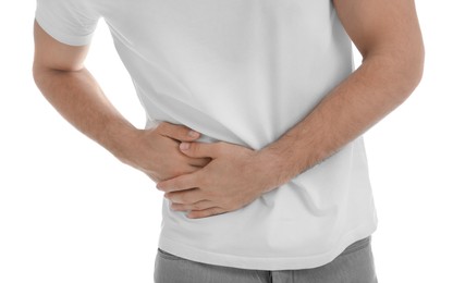 Photo of Man suffering from pain in lower right abdomen on white background, closeup. Acute appendicitis